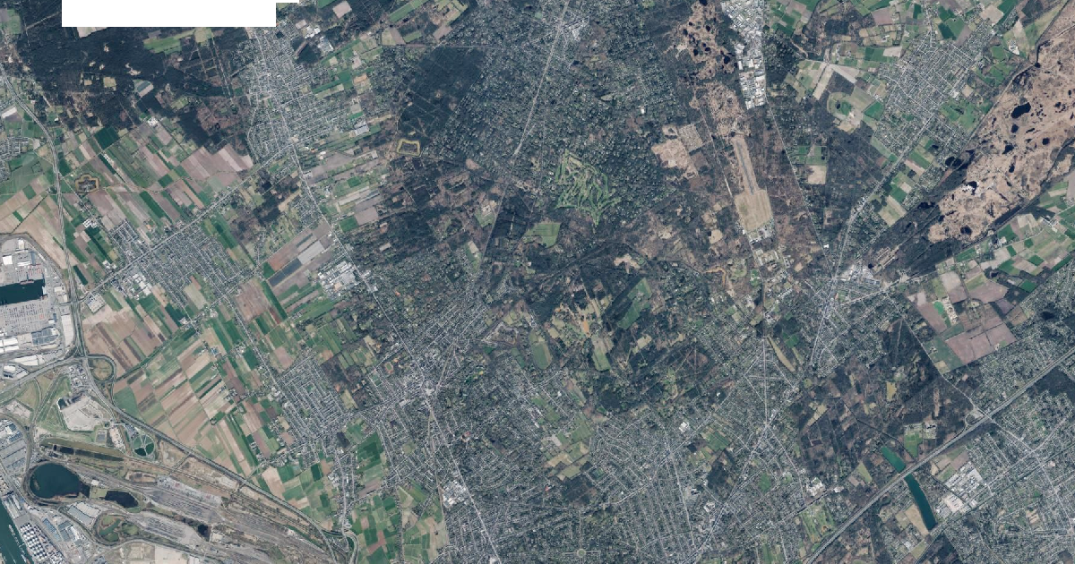 Luchtfoto van Kapellen met de gemeentegrens