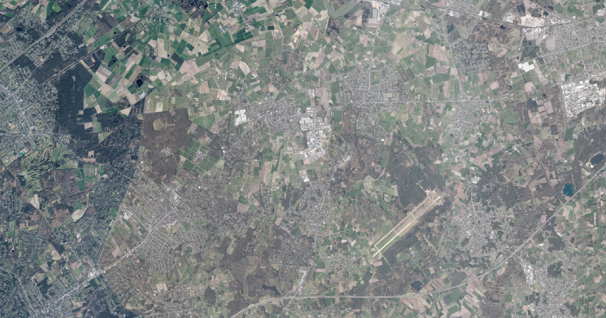 Luchtfoto van Malle met de gemeentegrens