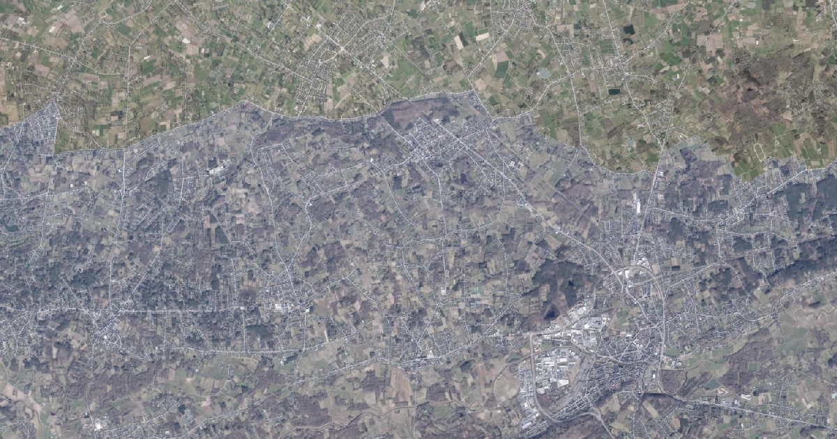 Luchtfoto van Begijnendijk met de gemeentegrens
